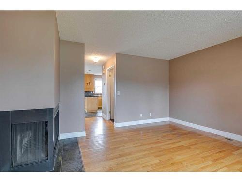 3507 49 Street Sw, Calgary, AB - Indoor Photo Showing Other Room With Fireplace