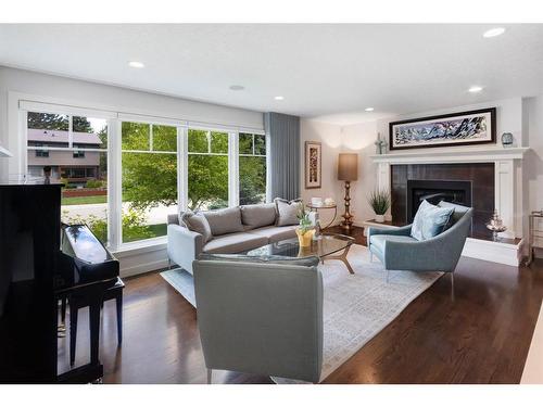 7211 Kananaskis Drive Sw, Calgary, AB - Indoor Photo Showing Living Room With Fireplace