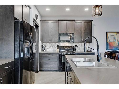 26 Chaparral Valley Green Se, Calgary, AB - Indoor Photo Showing Kitchen With Double Sink