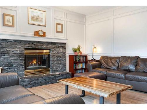 21 Deer River Green Se, Calgary, AB - Indoor Photo Showing Living Room With Fireplace