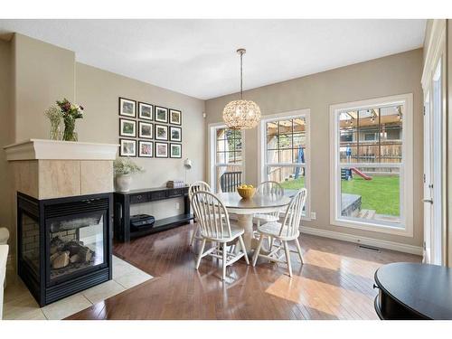 16 Covepark Mews Ne, Calgary, AB - Indoor Photo Showing Dining Room With Fireplace