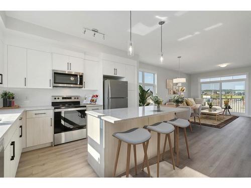 701-400 Belmont Street Sw, Calgary, AB - Indoor Photo Showing Kitchen With Stainless Steel Kitchen With Double Sink With Upgraded Kitchen