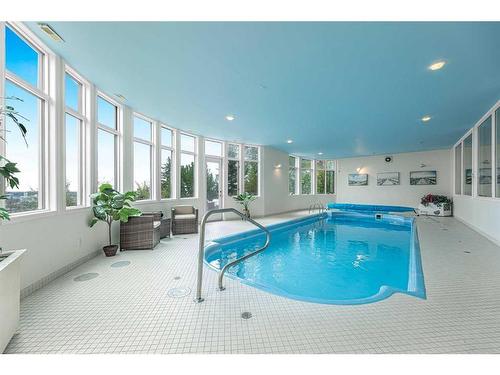36 Patina Hill Sw, Calgary, AB - Indoor Photo Showing Other Room With In Ground Pool