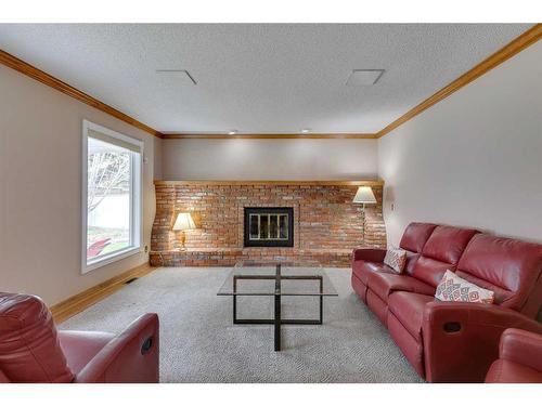 51 Edelweiss Crescent Nw, Calgary, AB - Indoor Photo Showing Living Room With Fireplace