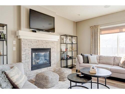 155 Kinniburgh Road, Chestermere, AB - Indoor Photo Showing Living Room With Fireplace