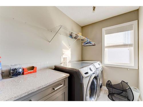 155 Kinniburgh Road, Chestermere, AB - Indoor Photo Showing Laundry Room