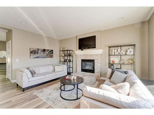 155 Kinniburgh Road, Chestermere, AB - Indoor Photo Showing Living Room With Fireplace