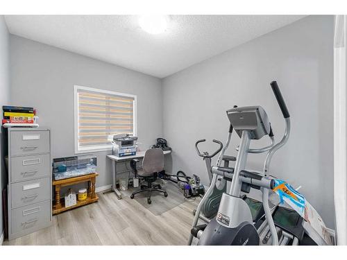 108 Hawkmere Way, Chestermere, AB - Indoor Photo Showing Gym Room