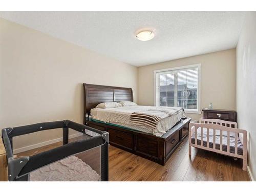 322-2400 Ravenswood View Se, Airdrie, AB - Indoor Photo Showing Bedroom