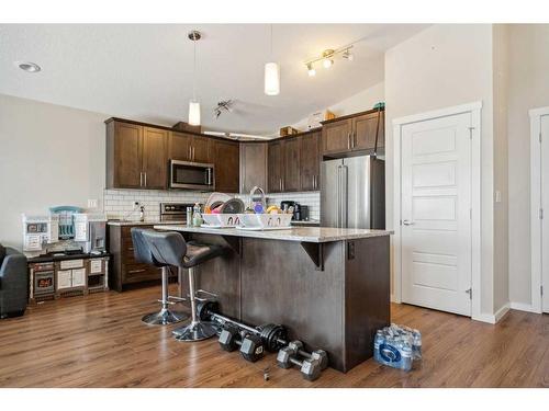 322-2400 Ravenswood View Se, Airdrie, AB - Indoor Photo Showing Kitchen With Stainless Steel Kitchen With Upgraded Kitchen