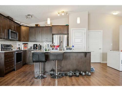 322-2400 Ravenswood View Se, Airdrie, AB - Indoor Photo Showing Kitchen