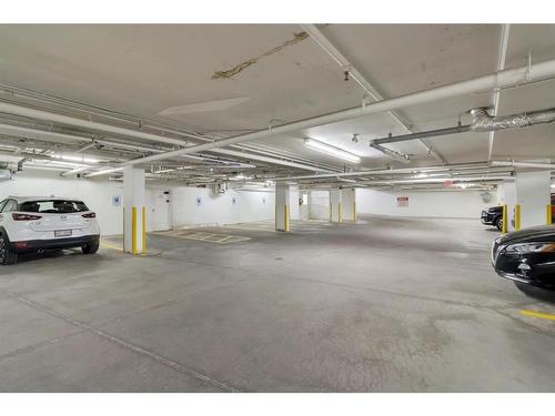 106-3320 3 Avenue Nw, Calgary, AB - Indoor Photo Showing Garage