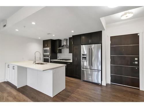 106-3320 3 Avenue Nw, Calgary, AB - Indoor Photo Showing Kitchen With Upgraded Kitchen