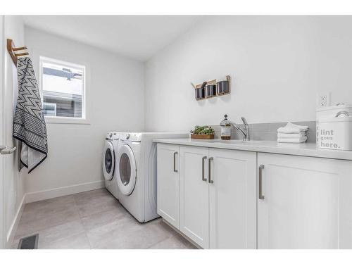 172 Emberside Hollow, Cochrane, AB - Indoor Photo Showing Laundry Room
