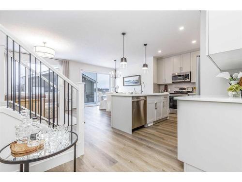 172 Emberside Hollow, Cochrane, AB - Indoor Photo Showing Kitchen With Upgraded Kitchen