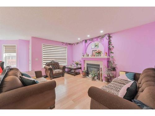 112 Saddlecrest Boulevard Ne, Calgary, AB - Indoor Photo Showing Living Room With Fireplace