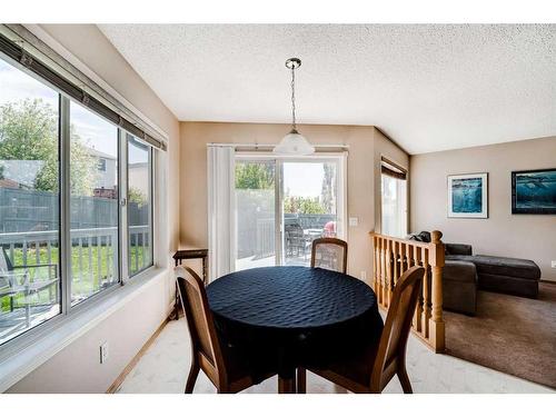 218 Arbour Butte Road Nw, Calgary, AB - Indoor Photo Showing Dining Room