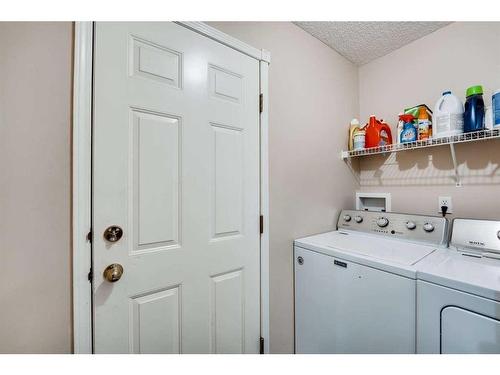 218 Arbour Butte Road Nw, Calgary, AB - Indoor Photo Showing Laundry Room