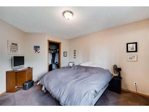 218 Arbour Butte Road Nw, Calgary, AB - Indoor Photo Showing Bedroom