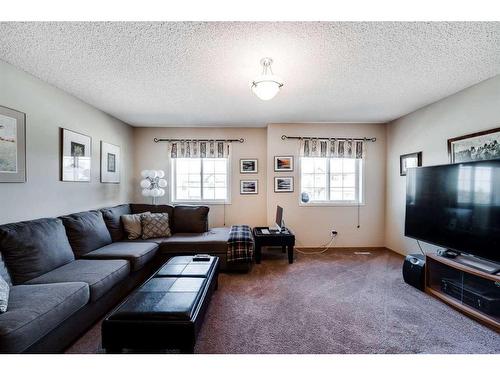 218 Arbour Butte Road Nw, Calgary, AB - Indoor Photo Showing Living Room