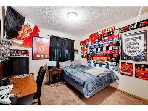 218 Arbour Butte Road Nw, Calgary, AB - Indoor Photo Showing Bedroom