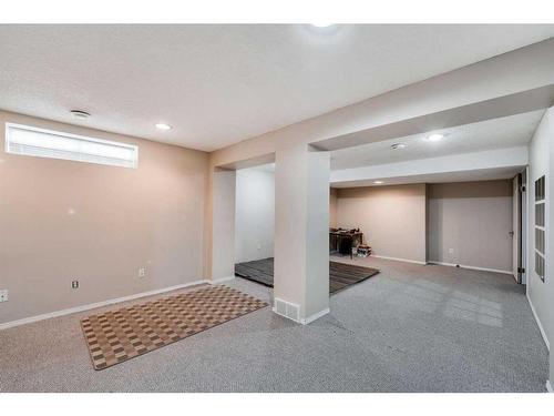 218 Arbour Butte Road Nw, Calgary, AB - Indoor Photo Showing Basement