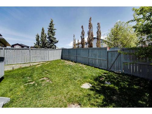 218 Arbour Butte Road Nw, Calgary, AB - Outdoor With Backyard