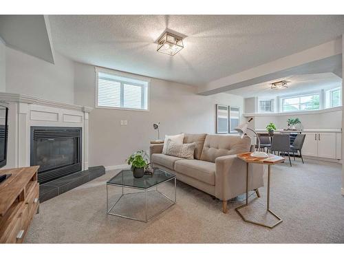 40 Tuscany Valley Park Nw, Calgary, AB - Indoor Photo Showing Living Room With Fireplace
