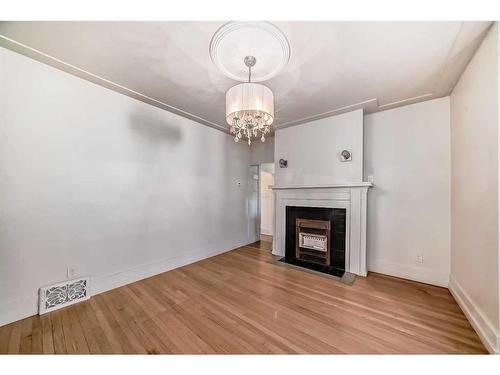 114 7 Avenue Nw, Calgary, AB - Indoor With Fireplace