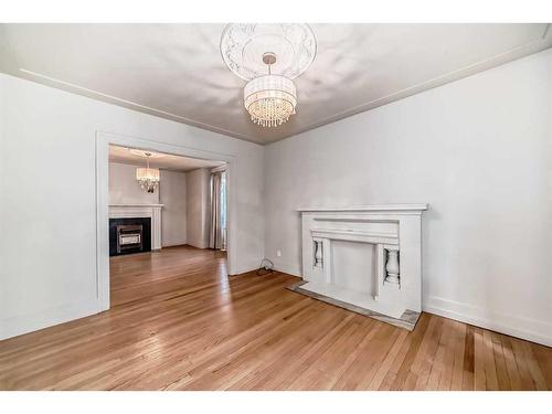 114 7 Avenue Nw, Calgary, AB - Indoor With Fireplace