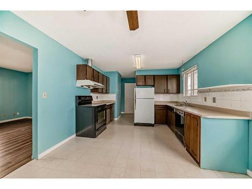 1035 Marcombe Crescent Ne, Calgary, AB - Indoor Photo Showing Kitchen With Double Sink