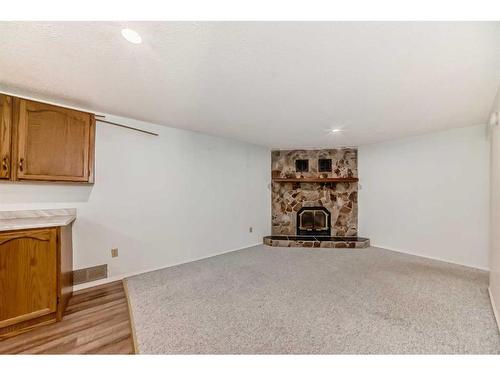 1035 Marcombe Crescent Ne, Calgary, AB - Indoor With Fireplace