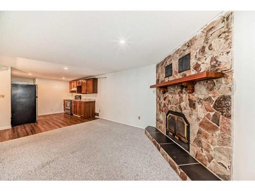 1035 Marcombe Crescent Ne, Calgary, AB - Indoor With Fireplace