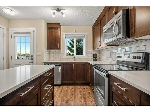1307-2400 Ravenswood View Se, Airdrie, AB - Indoor Photo Showing Kitchen With Upgraded Kitchen