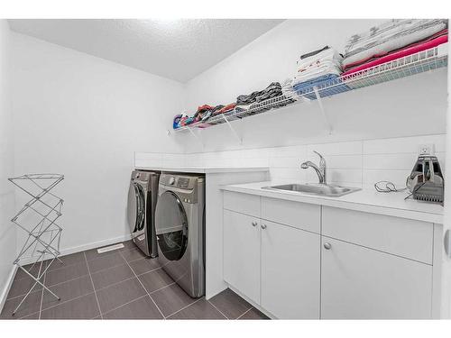 43 Walden Court Se, Calgary, AB - Indoor Photo Showing Laundry Room