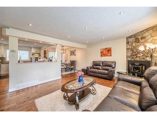 3832 Varsity Drive Nw, Calgary, AB - Indoor Photo Showing Living Room With Fireplace