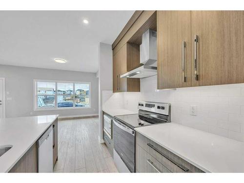 733 Carrington Boulevard, Calgary, AB - Indoor Photo Showing Kitchen With Upgraded Kitchen