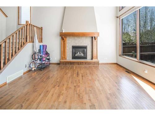 530 Chaparral Drive Se, Calgary, AB - Indoor Photo Showing Living Room With Fireplace