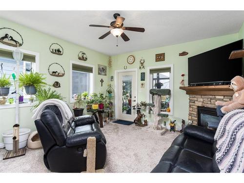 79 Harrison Green, Olds, AB - Indoor Photo Showing Other Room With Fireplace