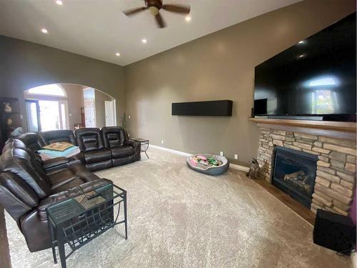 79 Harrison Green, Olds, AB - Indoor Photo Showing Living Room With Fireplace