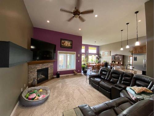 79 Harrison Green, Olds, AB - Indoor Photo Showing Living Room With Fireplace