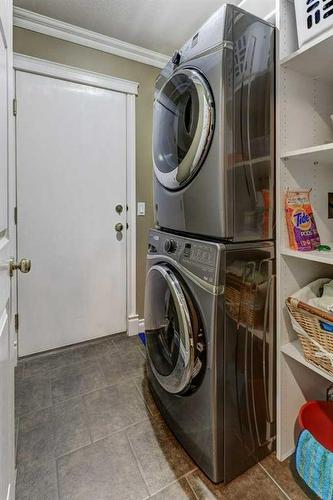 58 Arbour Butte Road Nw, Calgary, AB - Indoor Photo Showing Laundry Room