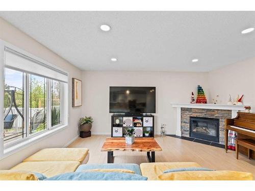 164 Cranfield Park Se, Calgary, AB - Indoor Photo Showing Living Room With Fireplace