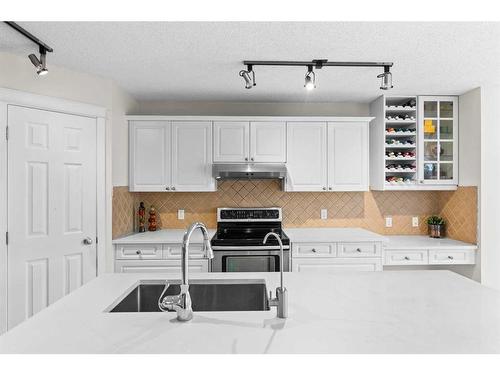 164 Cranfield Park Se, Calgary, AB - Indoor Photo Showing Kitchen With Double Sink