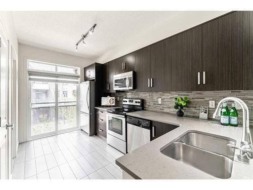 510 Walden Circle Se, Calgary, AB - Indoor Photo Showing Kitchen With Double Sink