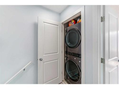 75 New Brighton Point Se, Calgary, AB - Indoor Photo Showing Laundry Room