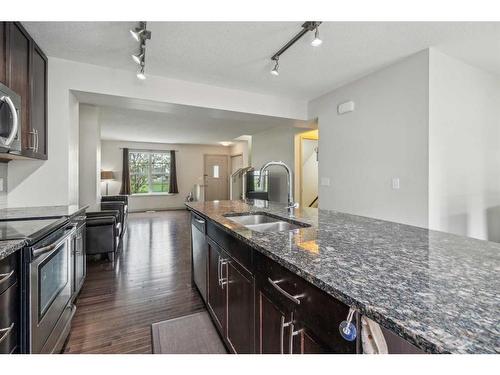 310 Cranford Court Se, Calgary, AB - Indoor Photo Showing Kitchen With Double Sink With Upgraded Kitchen