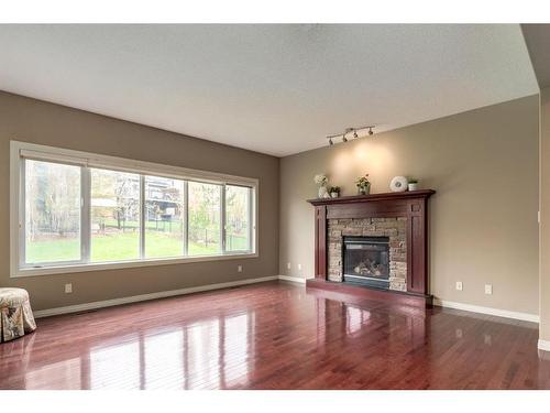 68 Heritage Lake Terrace, Heritage Pointe, AB - Indoor Photo Showing Living Room With Fireplace