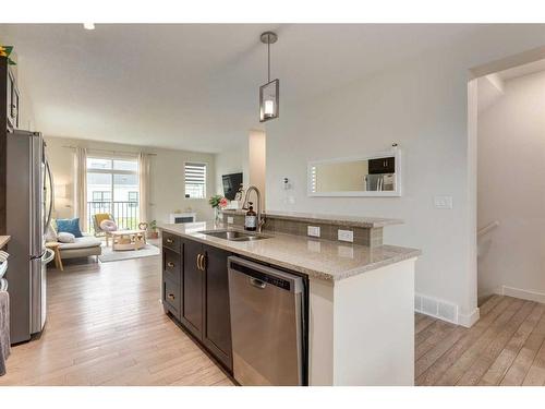 103 Nolanfield Villas Nw, Calgary, AB - Indoor Photo Showing Kitchen With Double Sink