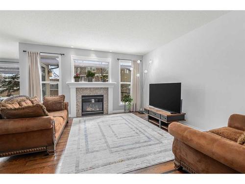 110 Cranleigh Way Se, Calgary, AB - Indoor Photo Showing Living Room With Fireplace